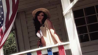 Cowgirl shows her assets in front of sheriff office title